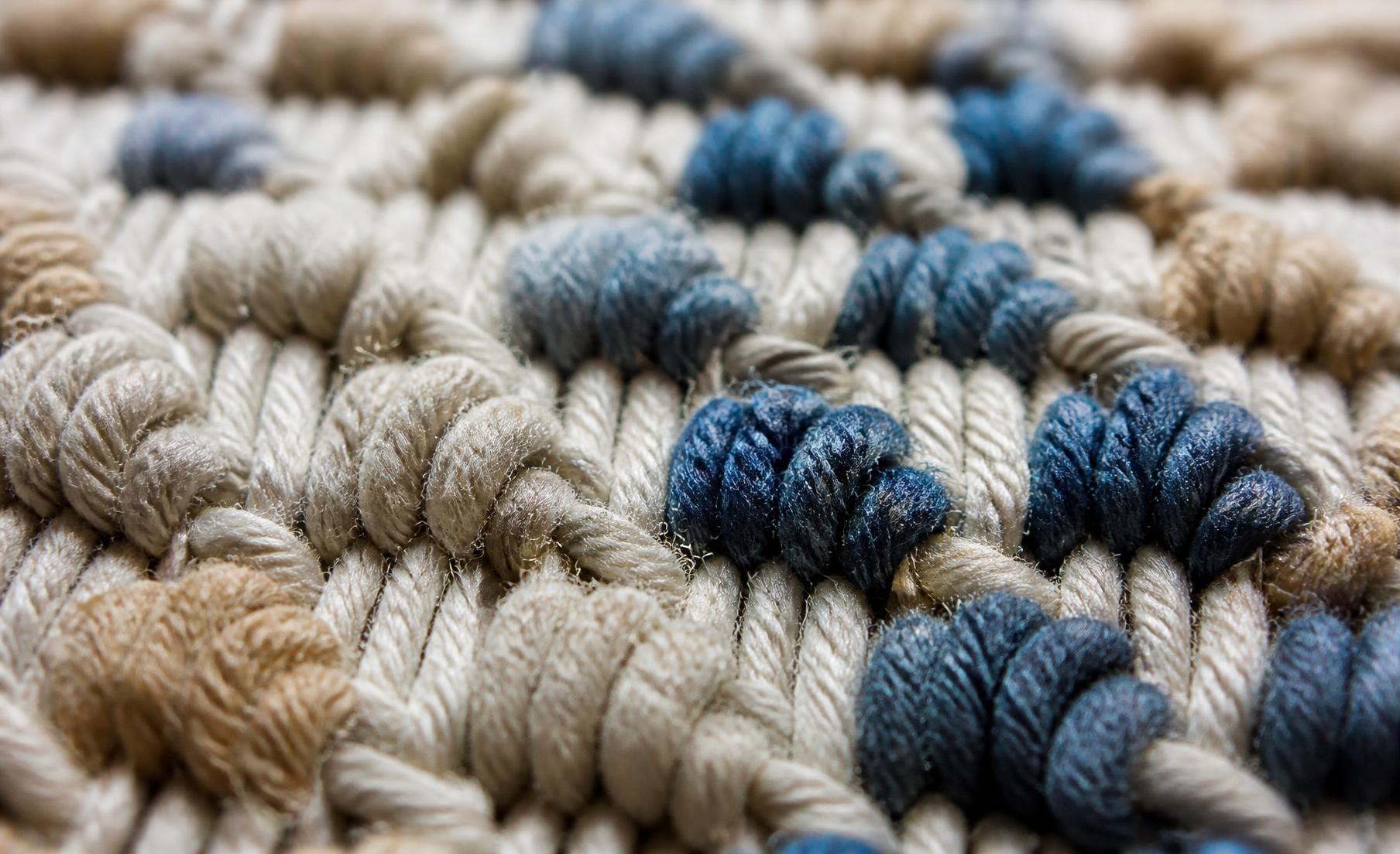 Macro photograph of hand-tied wool knots